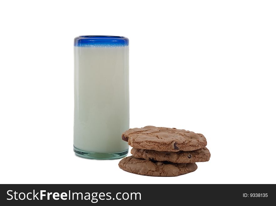 Stack of chocolate chip cookes and a glass of milk. Stack of chocolate chip cookes and a glass of milk.