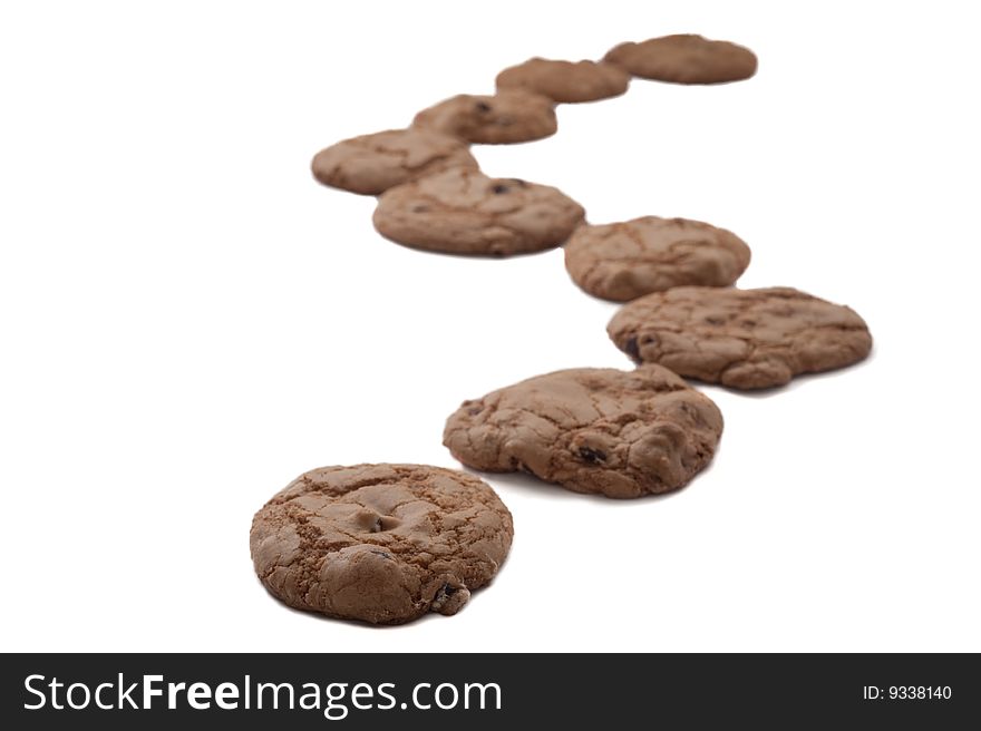 Chocolate chip cookies arranged as in a winding path. Chocolate chip cookies arranged as in a winding path.