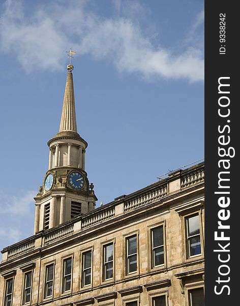 Historic clock and tower in terrace building in central Glasgow , Scotland. Historic clock and tower in terrace building in central Glasgow , Scotland