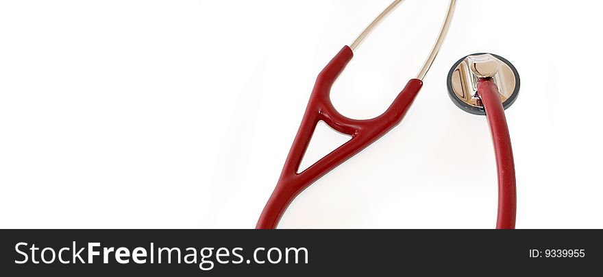 A maroon coloured stethoscope shot with a macro lens with ample copyspace to the left. A maroon coloured stethoscope shot with a macro lens with ample copyspace to the left