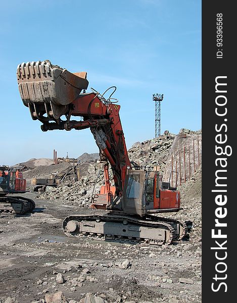 Industrial equipment excavator in quarry load stones. Industrial equipment excavator in quarry load stones