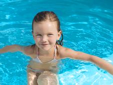 Girl In The Swimming Pool Stock Photography