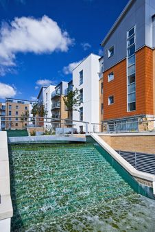 Modern Development With Water Feature Stock Photography