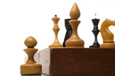 Chessmen On A Chessboard Royalty Free Stock Images