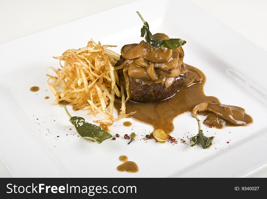 Veal with CEPS and potato chips. Veal with CEPS and potato chips