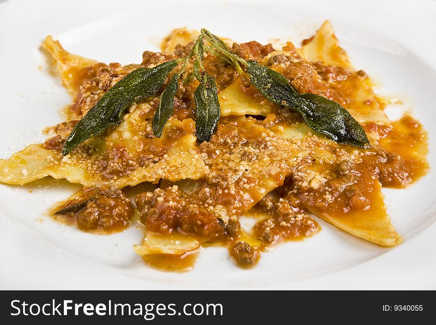 Italian ravioli versel'ez by a sauce and greenery