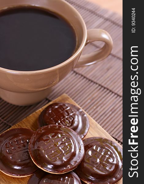 Sweet brown cookies with coffee. Sweet brown cookies with coffee