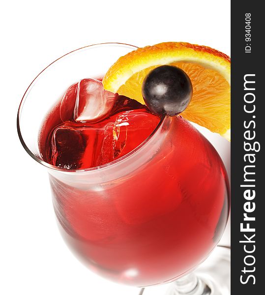 Red Alcoholic Cocktail with Orange Slice and Grape. Red Alcoholic Cocktail with Orange Slice and Grape