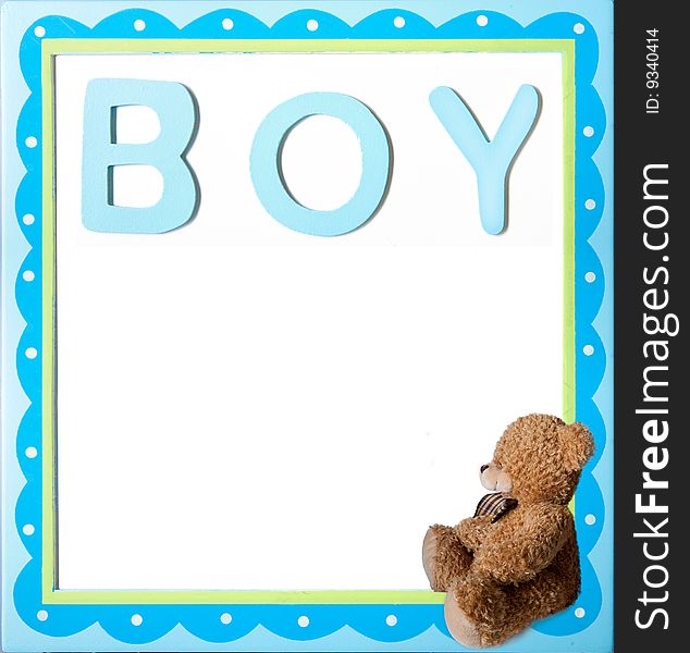 Teddy bear sitting in the box with the boy word on it