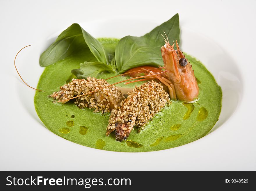 Soup from spinach with shrimps and fuagra