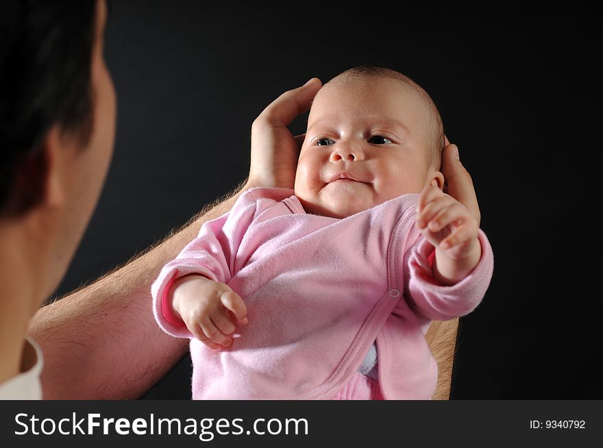 Little baby in dad's hands