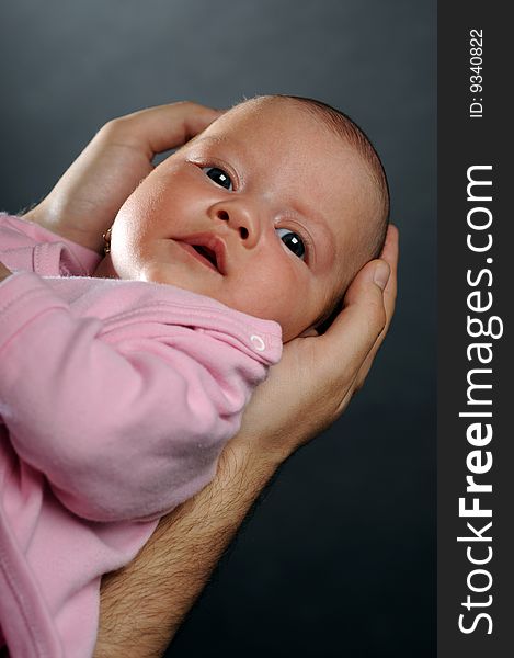 Little baby in dad's hands