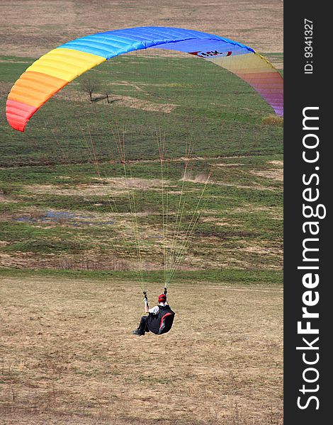 The glider pilot soars in a dynamic stream near a slope. The glider pilot soars in a dynamic stream near a slope.