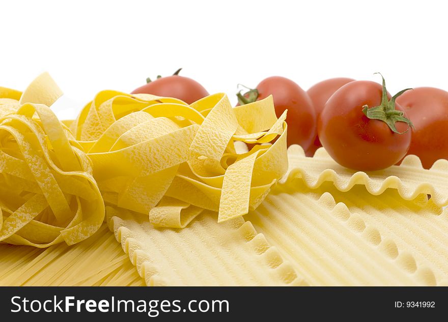 Spaghetti and mature tomato isolated on white background. Spaghetti and mature tomato isolated on white background