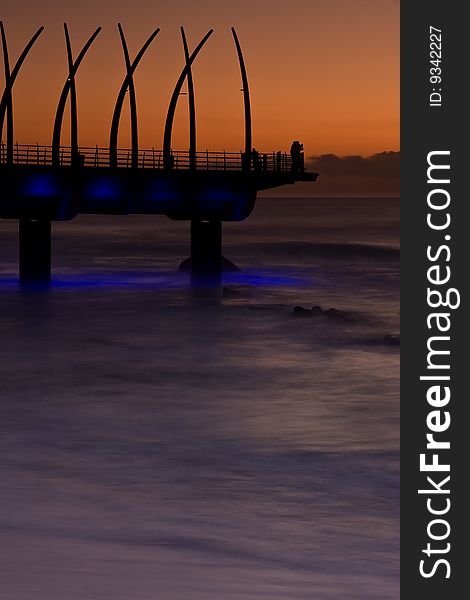 Umhlanga Pier at sunrise with lights on. Umhlanga Pier at sunrise with lights on