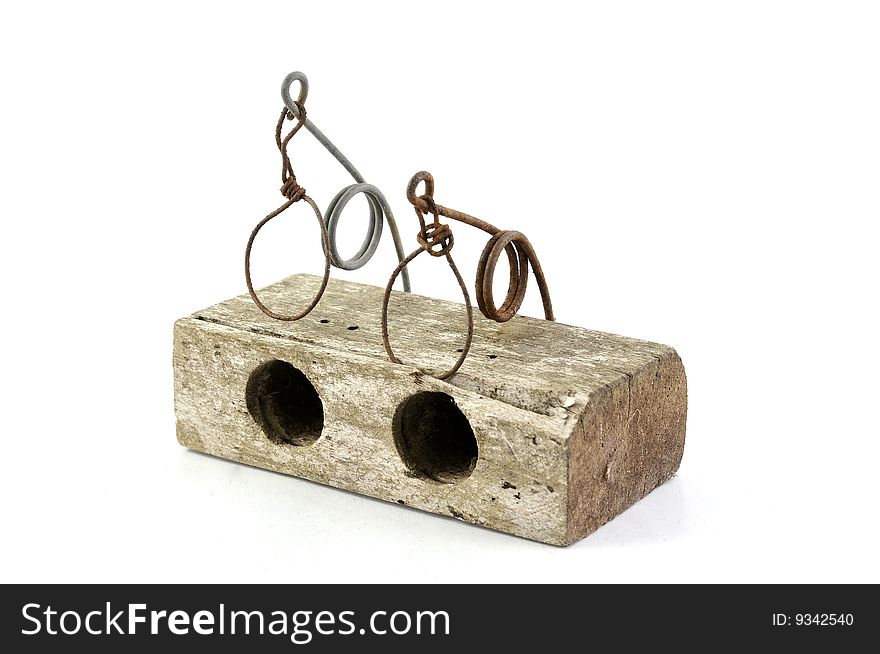Old wooden mouse trap isolated on a white background