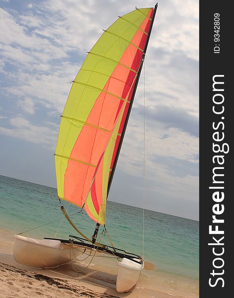 Catamaran with colored sail at the Caribbean Sea