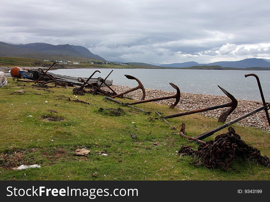 Old abandoned anchors on Achiltibuie beach in the Scottish Highlands. Old abandoned anchors on Achiltibuie beach in the Scottish Highlands