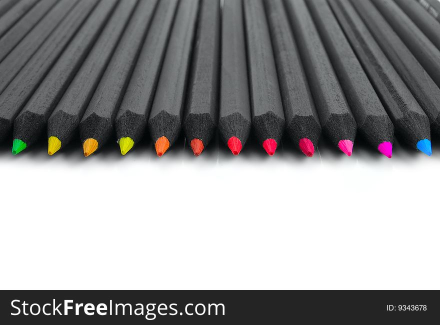 Black colored pencils on a white background. Black colored pencils on a white background