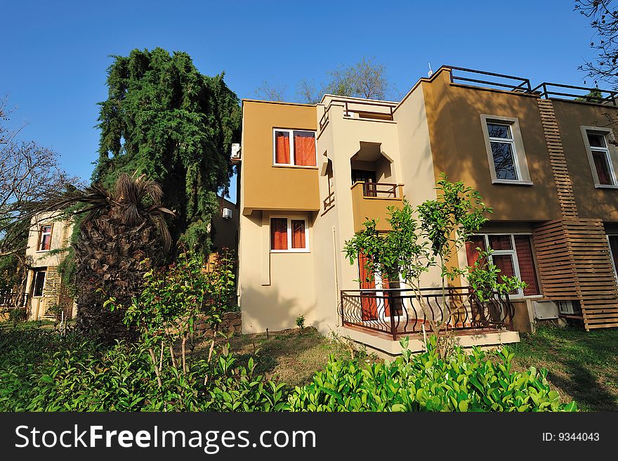 New cottage in tropical garden wide angle lens