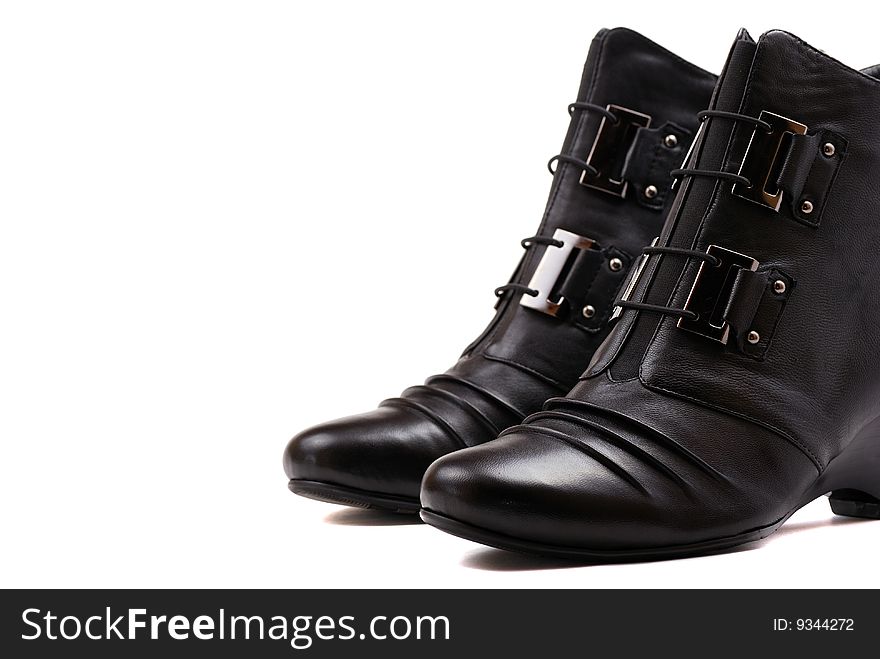 Stylish female boots of black colour of graceful modern design.