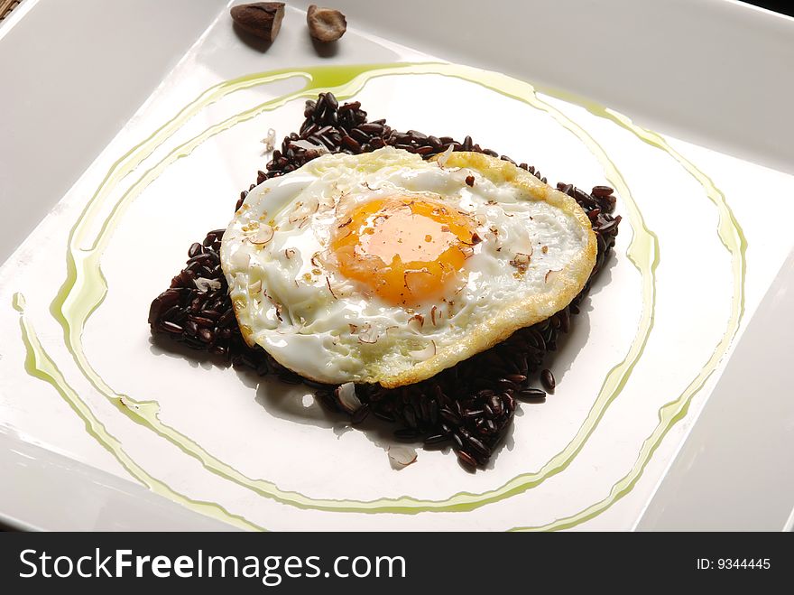Egg fried rice with black and brown. Egg fried rice with black and brown
