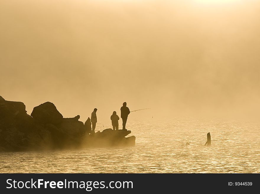 Anglers in the mist