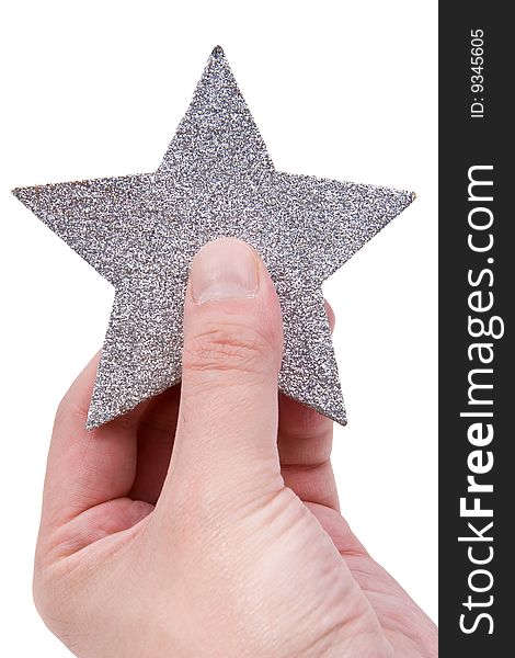 Silvery star in a hand isolated on a white background. Silvery star in a hand isolated on a white background