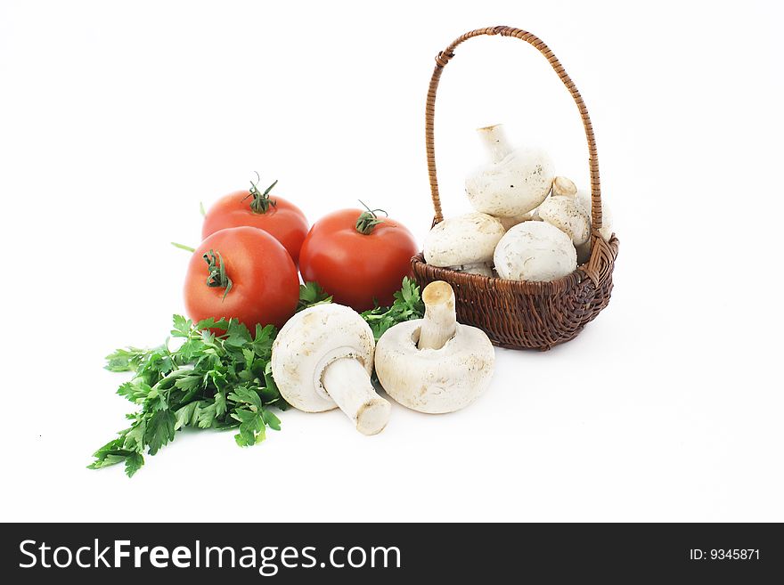 Basket, tomatoes, mushrooms and parsley. Basket, tomatoes, mushrooms and parsley