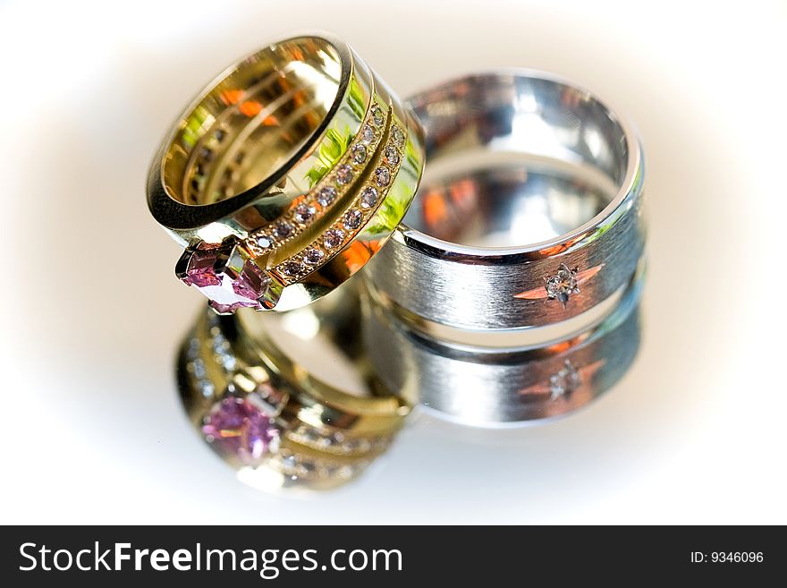 Two wedding rings with reflection