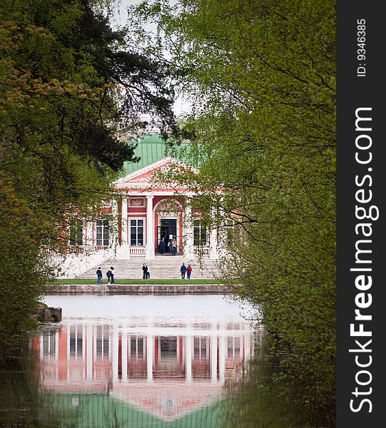 Old manor on the bank of a pond