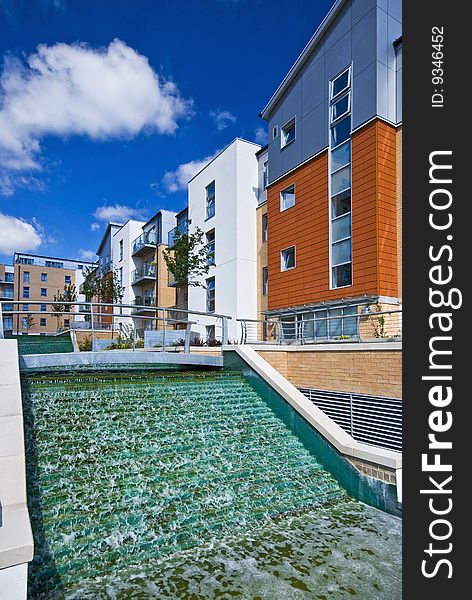 Contemporary development with water feature and landscaped gardens. Contemporary development with water feature and landscaped gardens