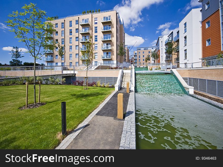 Contemporary development with water feature and landscaped gardens. Contemporary development with water feature and landscaped gardens