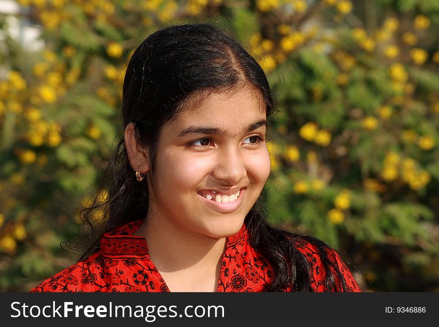 A sweet smile of a young girl's portrait.