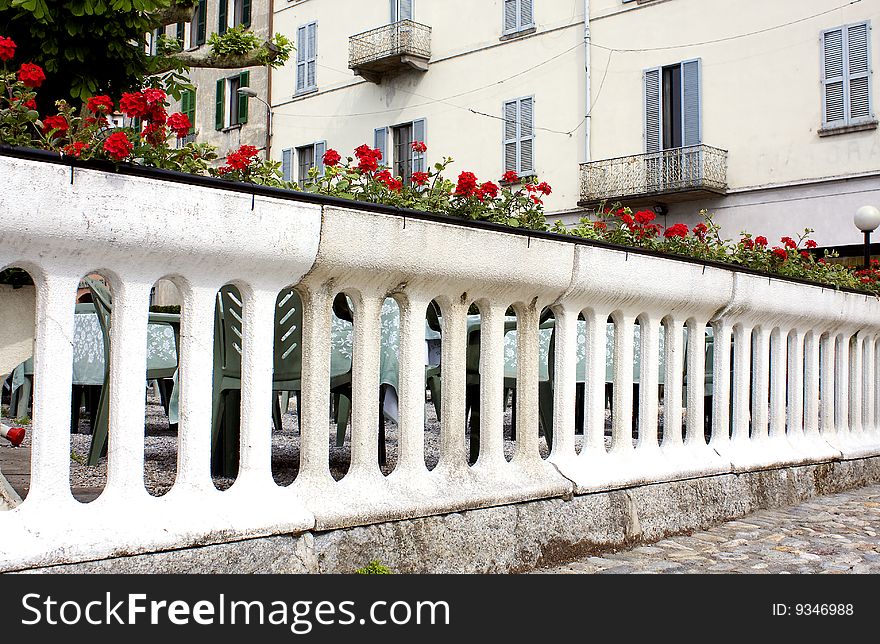 White balustrade with vases of flowers