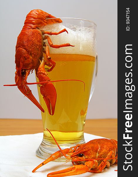 Glass of light beer with lobsters