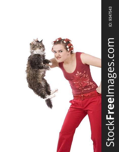 Portrait of a young girl with an angry expression. Very frustrated and angry mad woman. Angry look on face. Housewife is holding soil cat.  The cat leaves droppings.