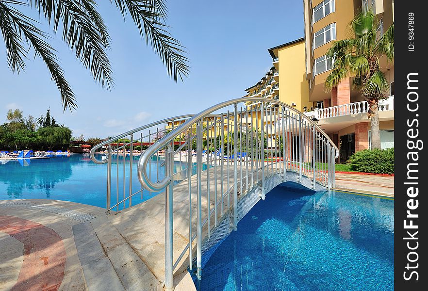 Small bridge across resort's pool. Small bridge across resort's pool