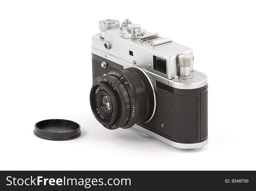 Vintage camera with lens cap isolated on pure white. Vintage camera with lens cap isolated on pure white
