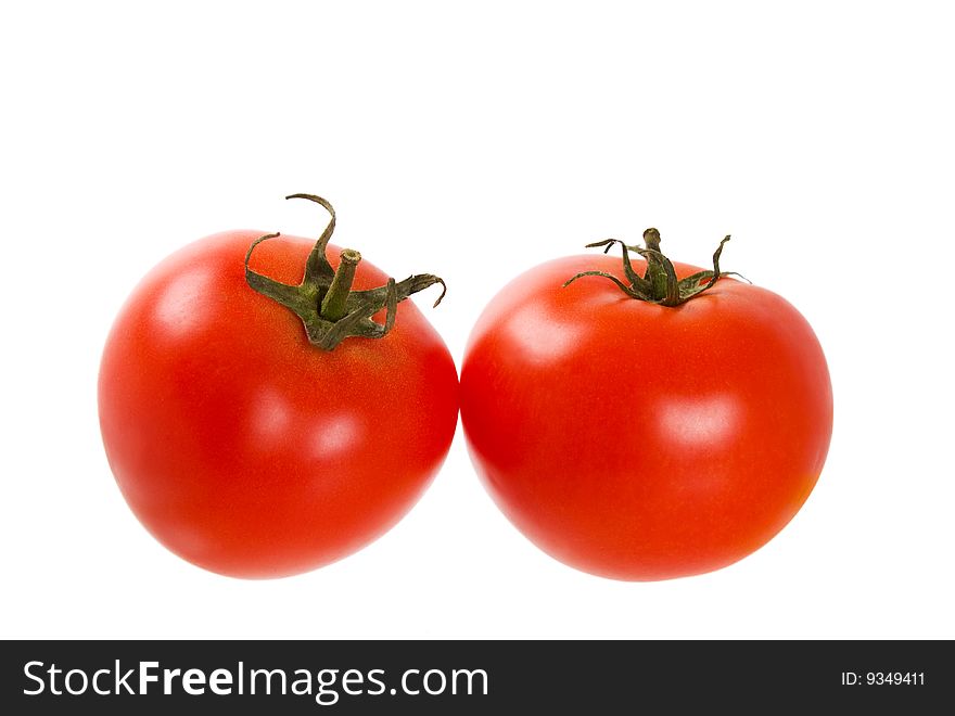 Two ripe tomatoes. Isolated on white