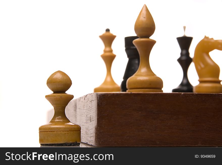 Chessmen on a chessboard, white background