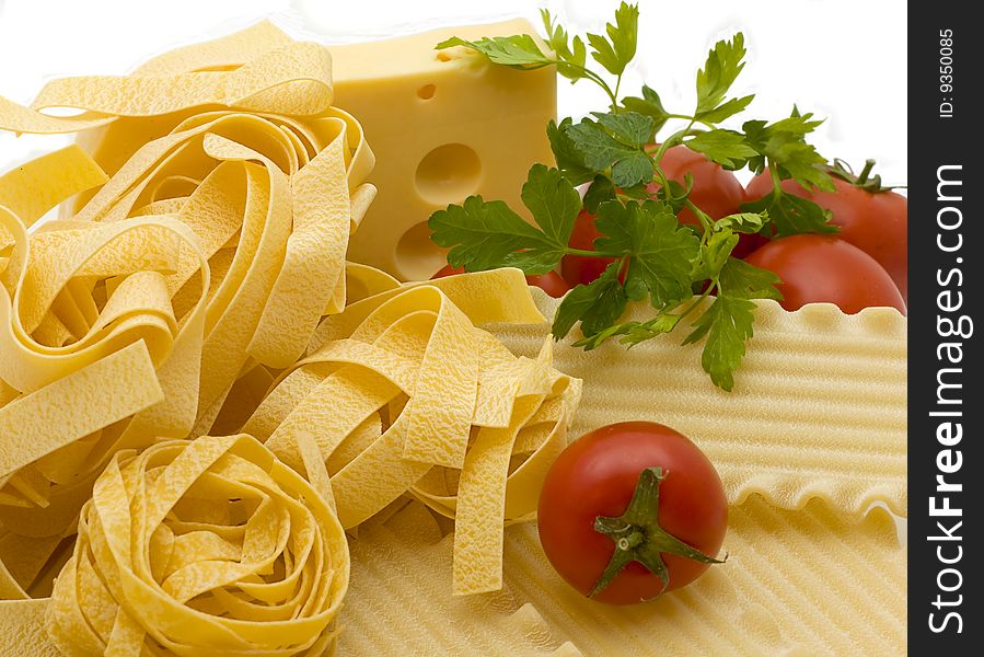 Spaghetti and mature tomato isolated on a white background. Spaghetti and mature tomato isolated on a white background