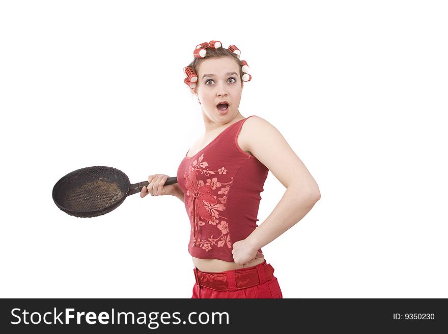 Woman in hair rollers. Housewife with curlers in her hair, holding a frying pan. Very frustrated and angry mad woman. Angry look on face. Studio, white background. Woman in hair rollers. Housewife with curlers in her hair, holding a frying pan. Very frustrated and angry mad woman. Angry look on face. Studio, white background.