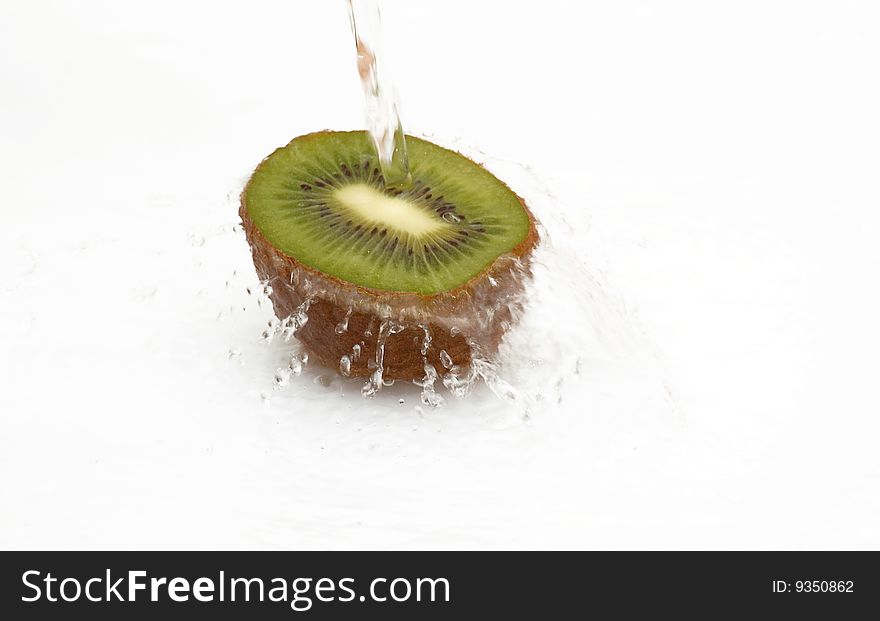 Half Of Juicy,ripe Kiwi With Drops Of Water.