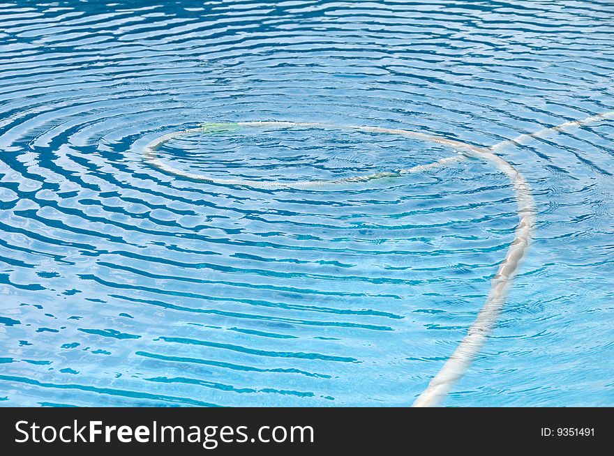 Water ripple in a very blue swimming pool