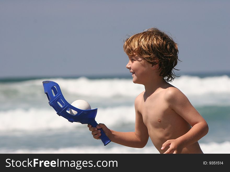 Boy playing at the beach. Boy playing at the beach