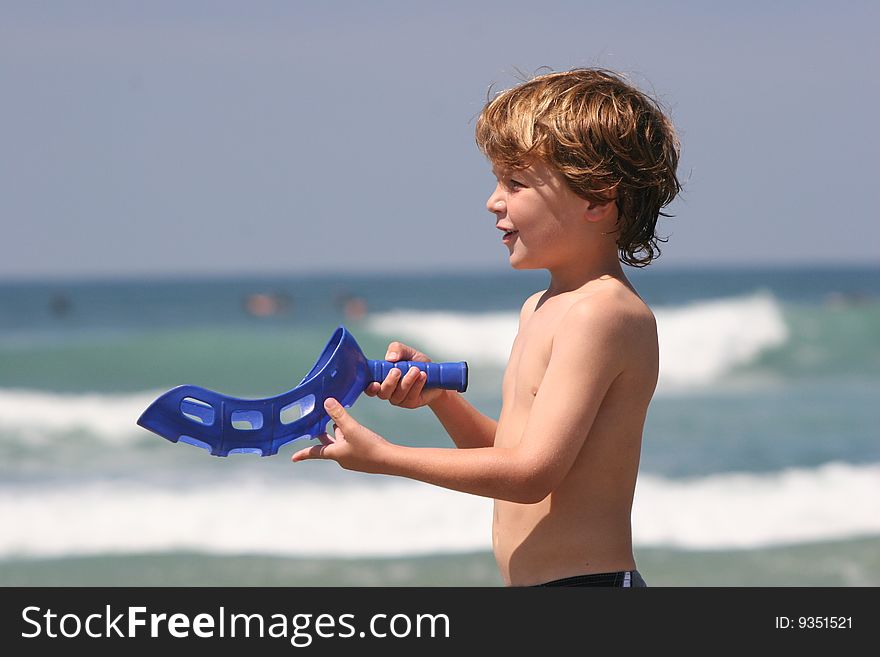 Boy Playing at Beach