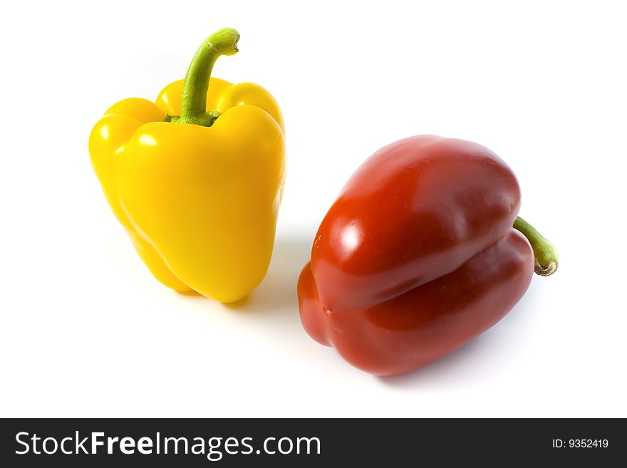 Red and yellow pepper on a white background. A photo close up
