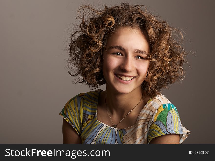 Portrait of the girl with curly hair. Portrait of the girl with curly hair