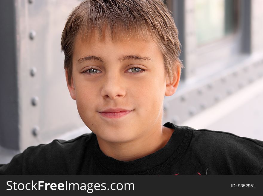 Boy looking assured with grey background